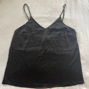 Nicole Miller. Elevate your style with this elegant size L blouse. Black color.